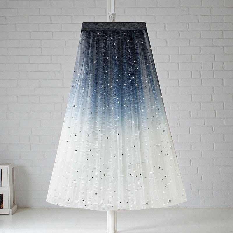 ZOFIA ATELIER white, blue, and black voluminous net yarn maxi skirt with sequin stars and ombre effect.