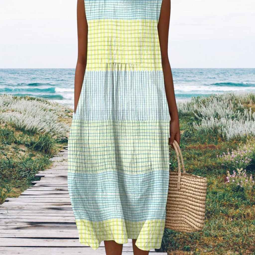 ZOFIA ATELIER sleeveless midi dress with pastel plaid pattern in yellow and blue, featuring a tiered design and pockets.