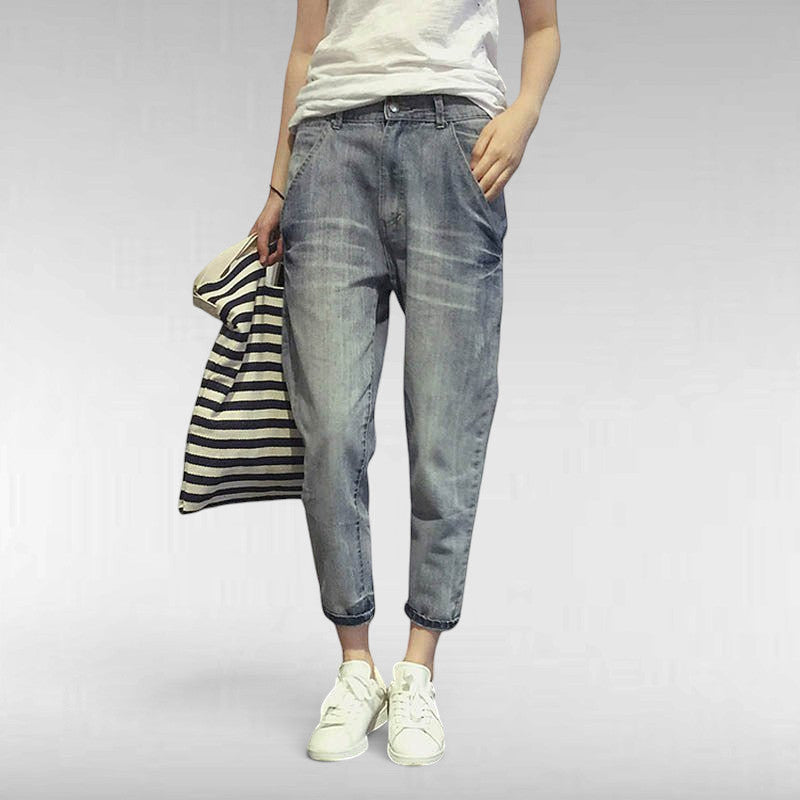 ZOFIA ATELIER light wash slim stretch cotton jeans with a relaxed fit and cropped ankle.