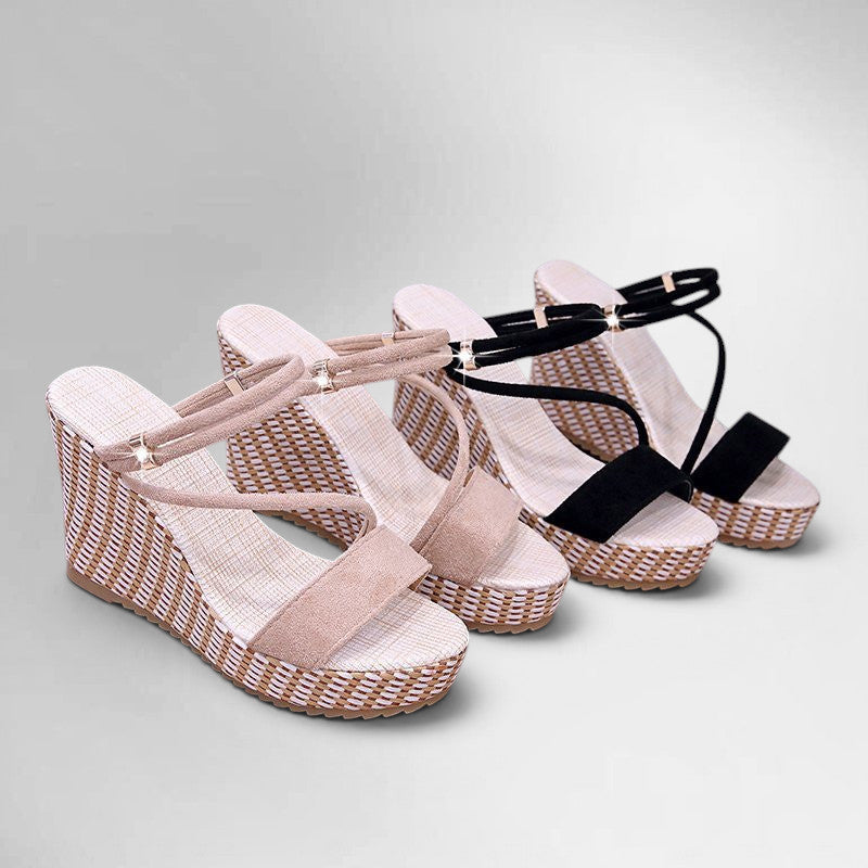 ZOFIA ATELIER Liliana slope heel sandals in black and beige suede with platform wedge sole and ankle straps.