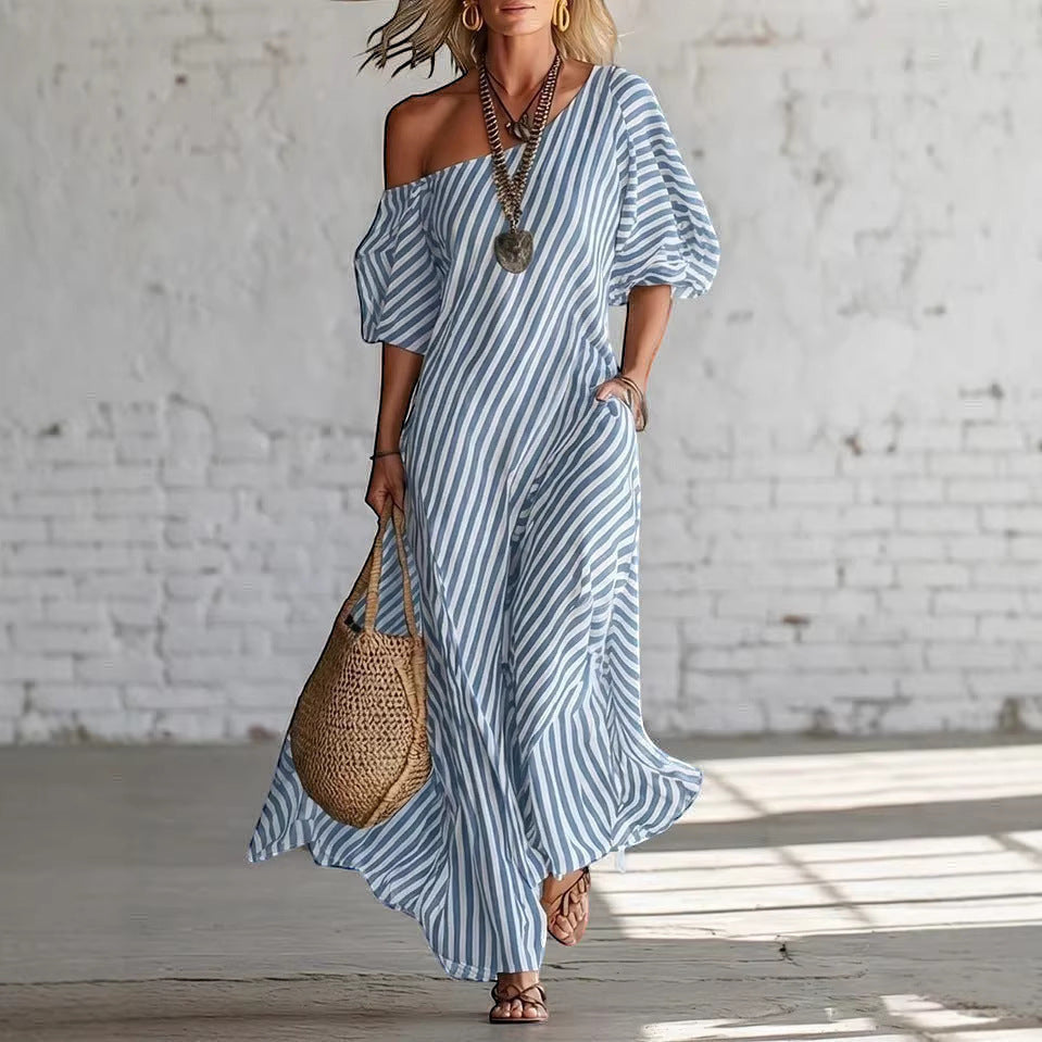 ZOFIA ATELIER SOFIA off-shoulder maxi dress in blue and white stripes, made of polyester, with short sleeves and pockets.