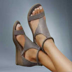 ZOFIA ATELIER Soraya Roman wedge sandals in grey artificial PU with hollow details and open toe.