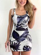 ZOFIA ATELIER white spaghetti strap dress with large navy blue tropical leaf print and cut-out details