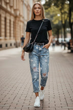 ZOFIA ATELIER light blue denim trousers with white stars and distressed details, slim fit, straight cut.