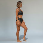 ZOFIA ATELIER Sylwia strappy dark grey bikini set with ruched high-waisted bottoms and a wrap-style top.