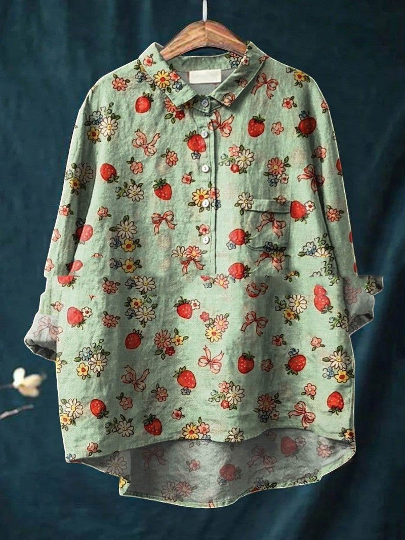 ZOFIA ATELIER light green long sleeve shirt with all-over strawberry, floral, and bow print. Features a collared neckline and button-up front.