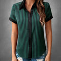 ZOFIA ATELIER KRYSTYNA loose green and black striped short-sleeve polyester blouse with black collar and cuffs.