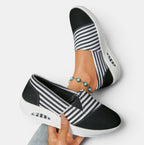 ZOFIA ATELIER black and white striped canvas slip-on shoes with a white sole and platform heel.