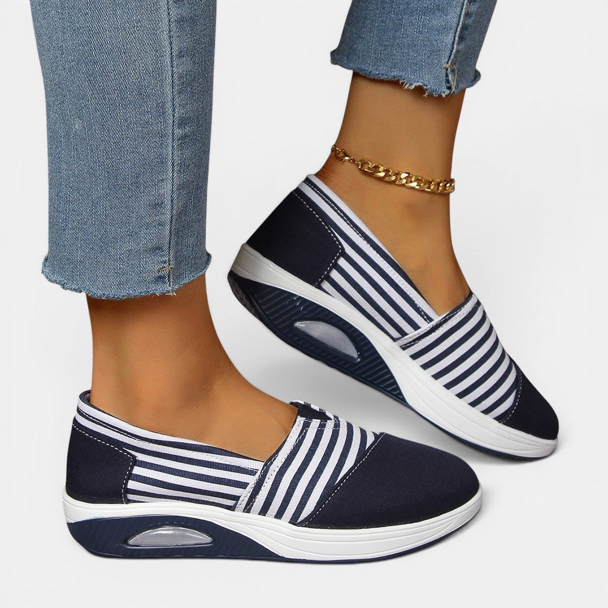 ZOFIA ATELIER navy and white striped canvas slip-on shoes with a shallow mouth and platform sole.