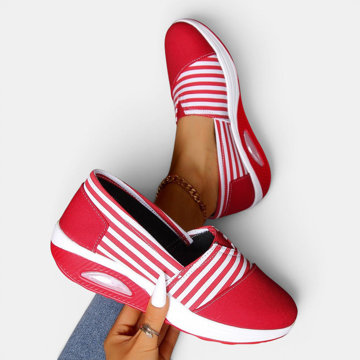 ZOFIA ATELIER red and white striped canvas slip-on shoes with a shallow mouth and rubber sole.