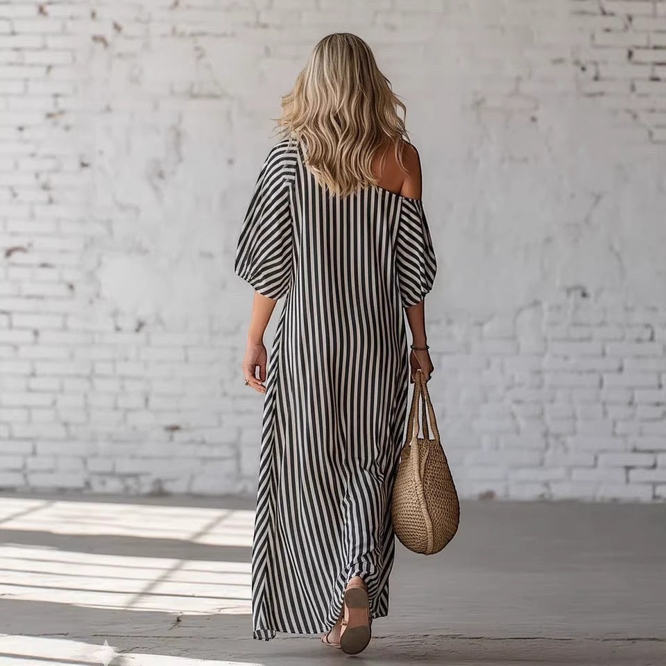 ZOFIA ATELIER black and white striped off-shoulder maxi dress with short sleeves and flowing polyester fabric.