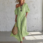 ZOFIA ATELIER green and white striped off-shoulder maxi dress made of polyester with short sleeves and pockets.