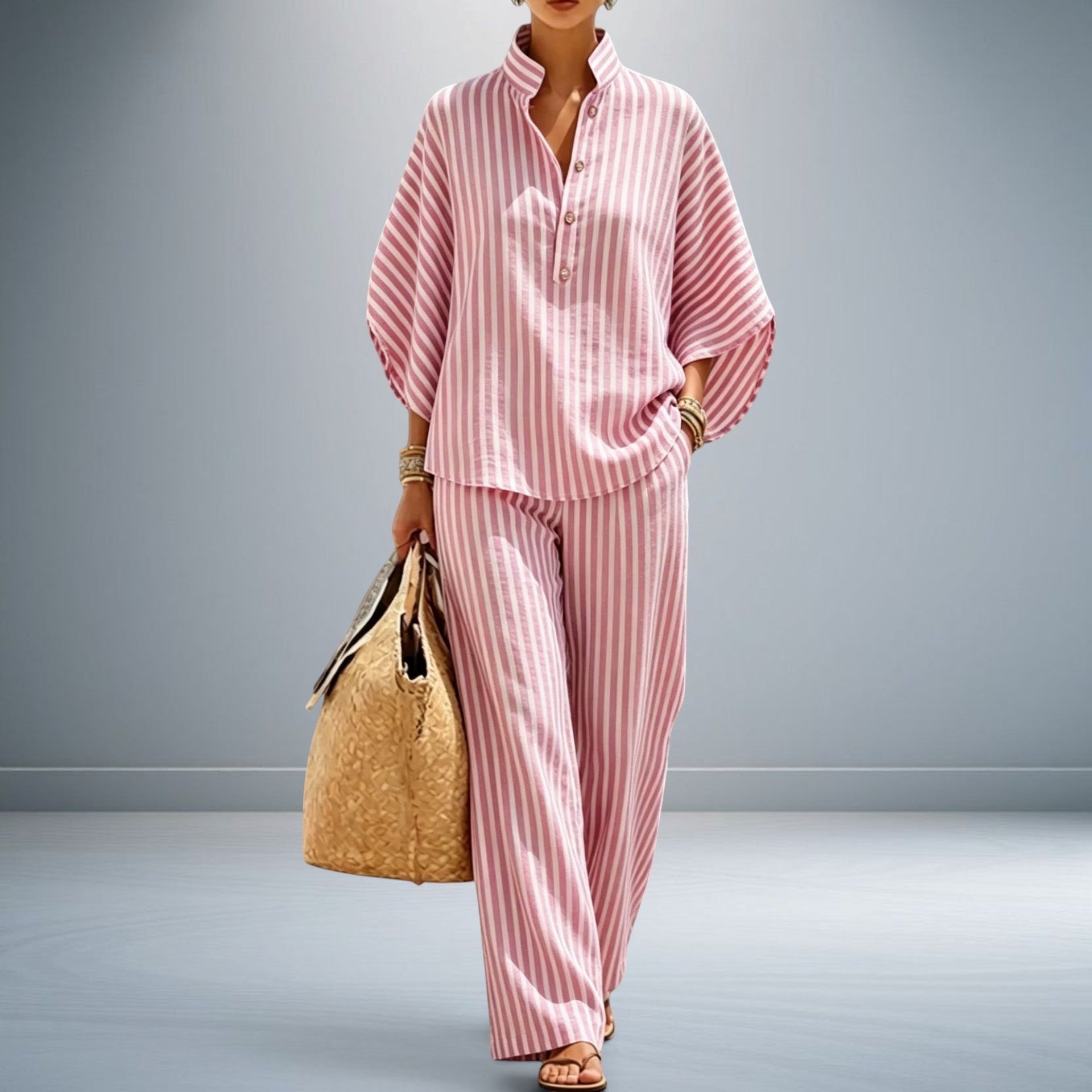 ZOFIA ATELIER pink and white striped polyester shirt and pants set with three-quarter sleeves.