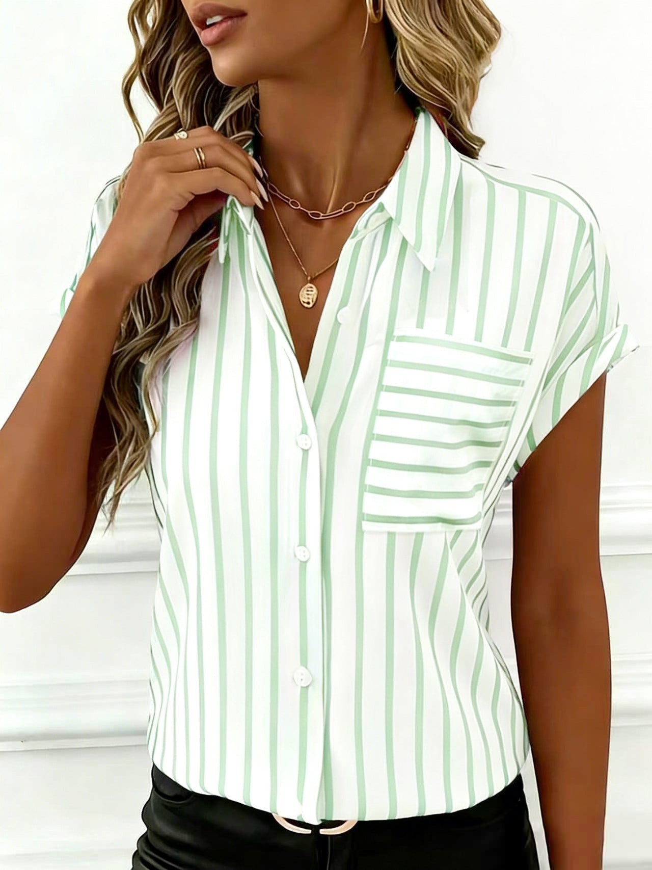 ZOFIA ATELIER white and green striped polyester shirt with short sleeves and a chest pocket. Loose fit.