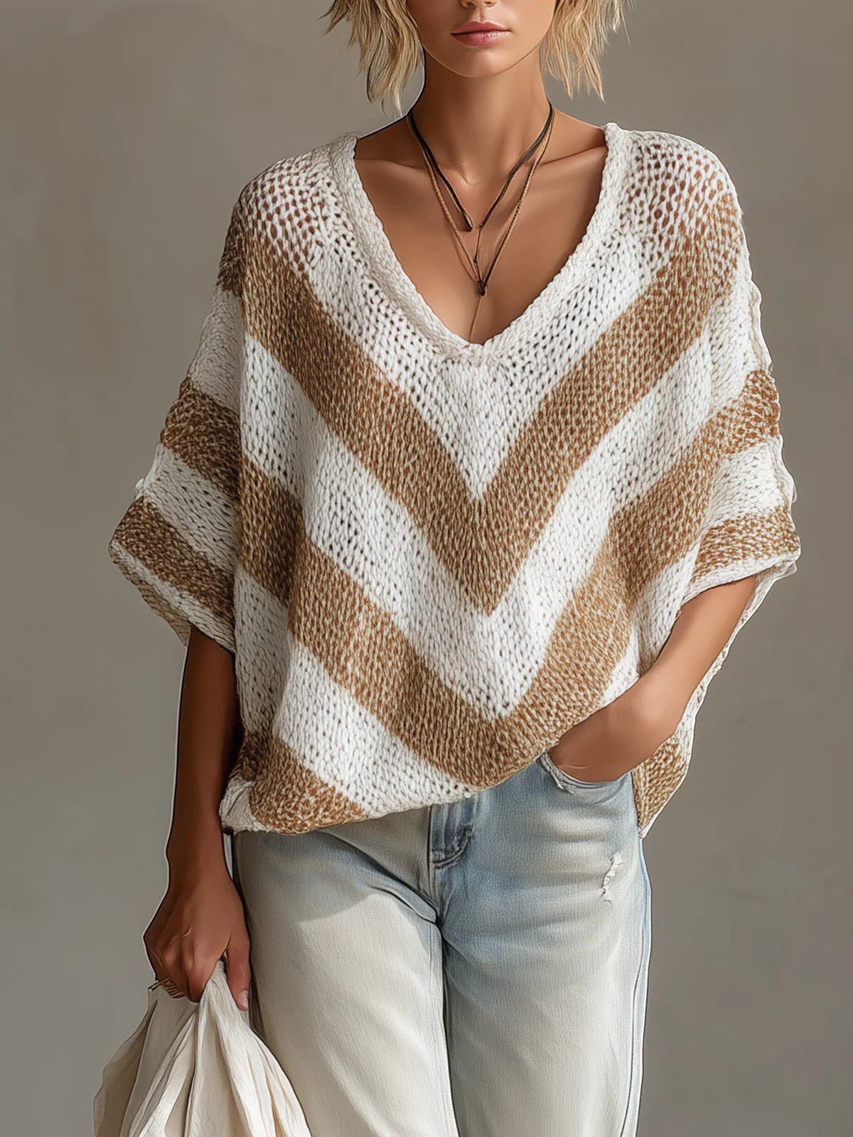 ZOFIA ATELIER white and tan striped V-neck loose-knit sweater with drop shoulders.