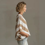 ZOFIA ATELIER white and tan striped loose-knit V-neck sweater with drop shoulder sleeves.