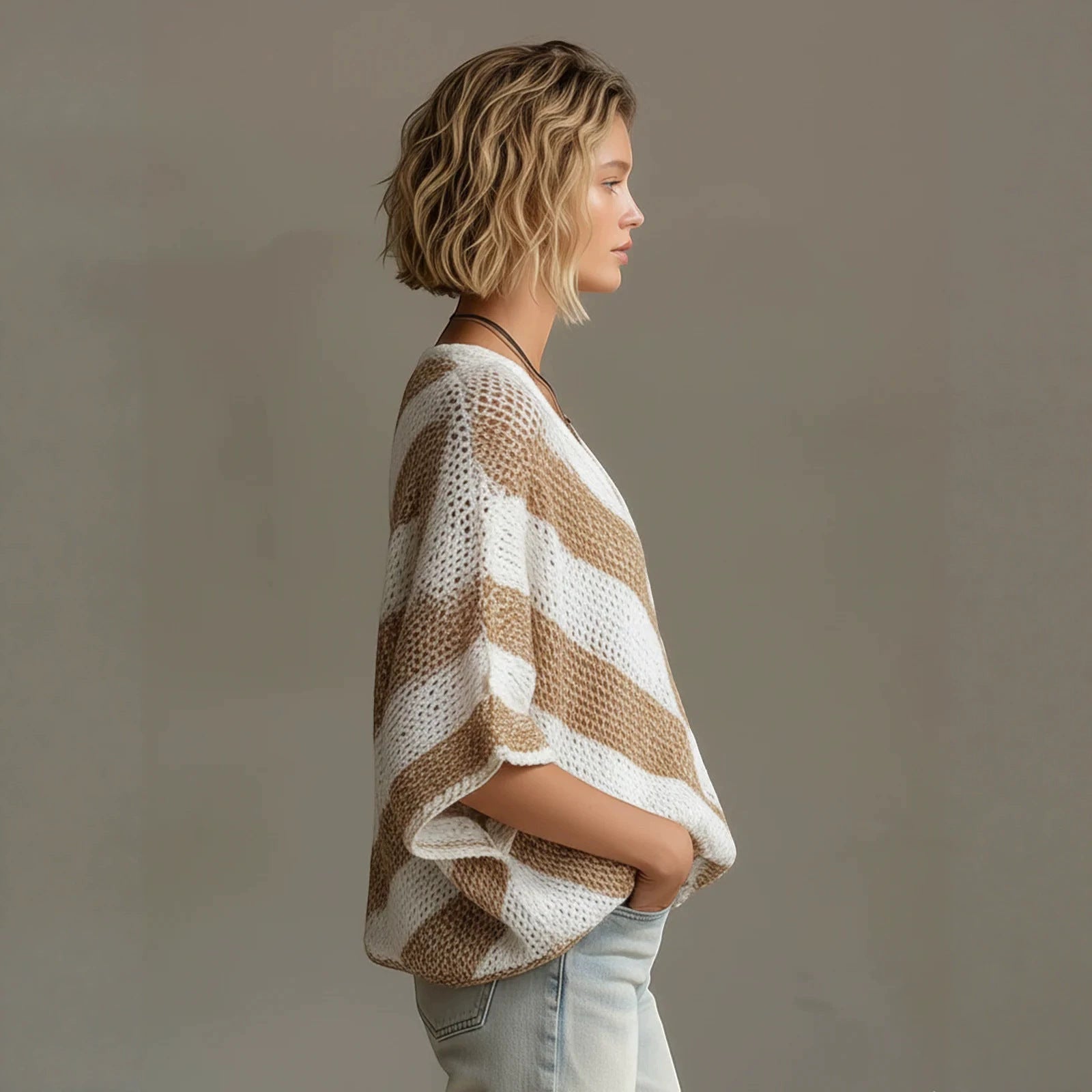 ZOFIA ATELIER white and tan striped loose-knit V-neck sweater with drop shoulder sleeves.