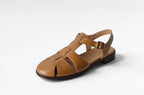 ZOFIA ATELIER tan leather retro Roman fisherman sandals with buckle strap and hollowed design.