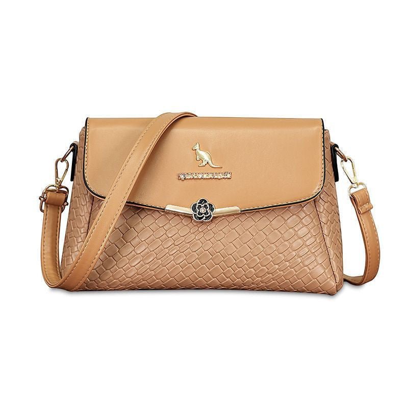 ZOFIA ATELIER tan PU leather crossbody bag with rhombus pattern and gold kangaroo emblem.
