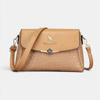 ZOFIA ATELIER large capacity crossbody bag in tan PU leather with rhombus pattern and gold kangaroo emblem.