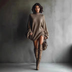 ZOFIA ATELIER taupe oversized knitted sweater dress with lantern sleeves and mock neck, worn with knee-high boots.