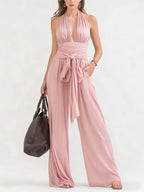 ZOFIA ATELIER TEODORA pink polyester halter-neck wide-leg jumpsuit with tie waist and plunging neckline.