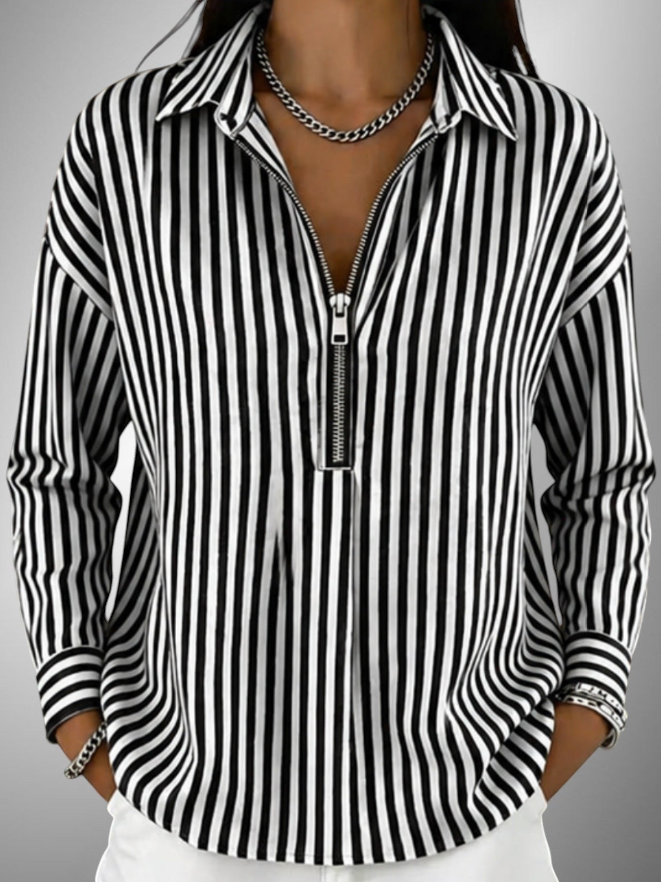 ZOFIA ATELIER URSZULA black and white striped polyester shirt with zipper front and long sleeves.