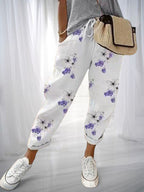 ZOFIA ATELIER white cotton linen pants with purple butterfly and floral print, loose fit, drawstring waist.