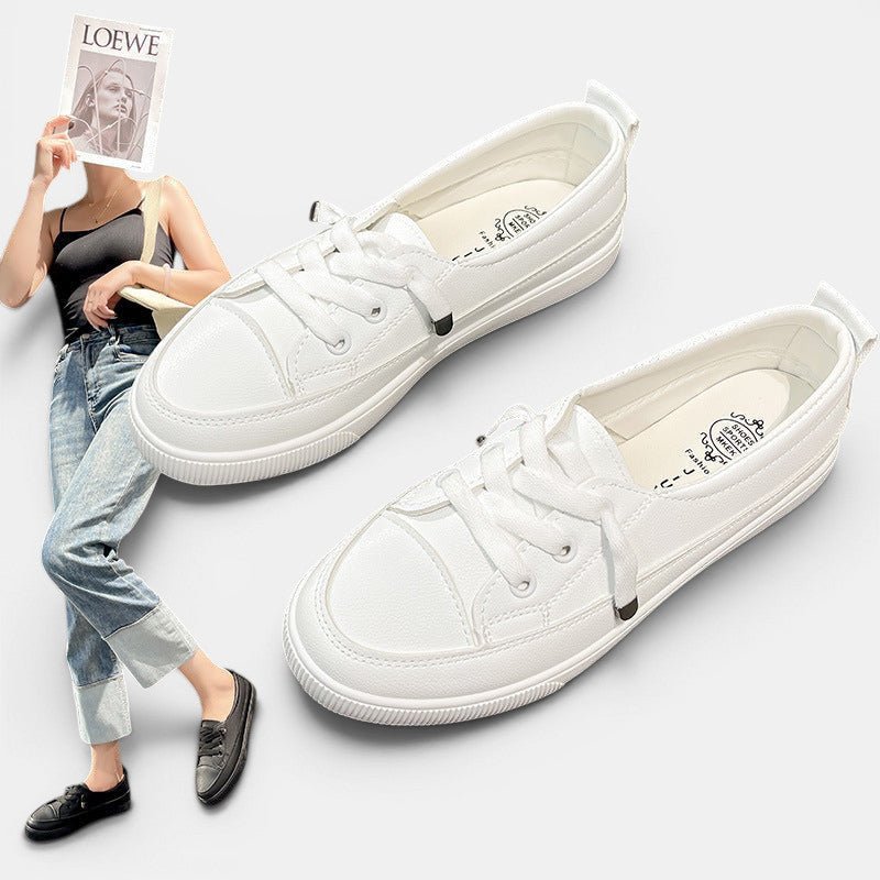 ZOFIA ATELIER white canvas sneakers with flat heel and round toe, front laces, and rubber outsole.