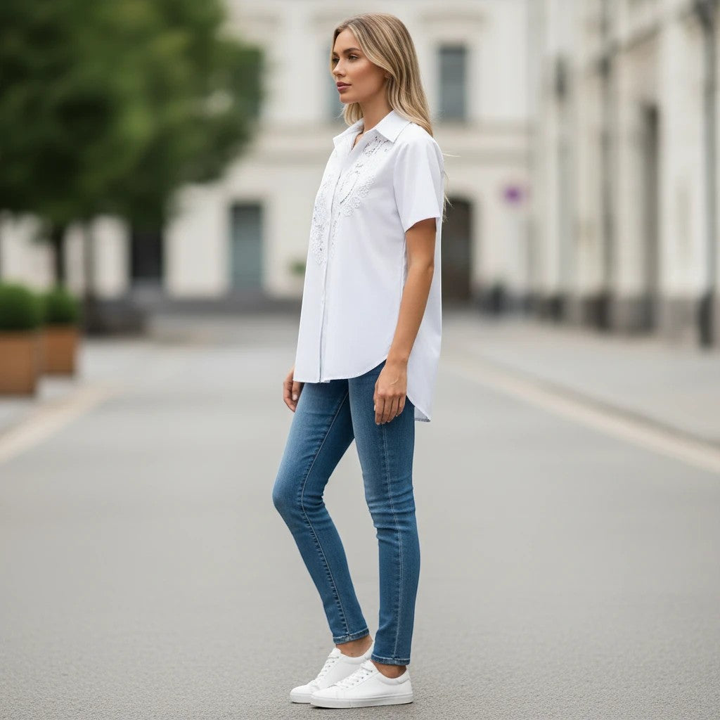 ZOFIA ATELIER white short-sleeved blouse with intricate embroidery and hollow-out design, made of polyester and rayon.