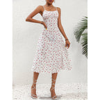 ZOFIA ATELIER white polyester midi dress with pink floral print, spaghetti straps, and a thigh-high slit.