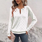 ZOFIA ATELIER white polyester long-sleeve top with hollow-out V-neck and eyelet details.