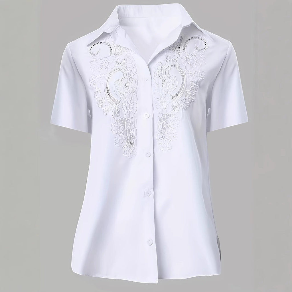 ZOFIA ATELIER white short-sleeved blouse with intricate embroidered lace detail and hollow-out design. Made from polyester and rayon.