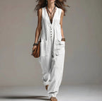 ZOFIA ATELIER white sleeveless polyester jumpsuit with lace trim and pockets. Straight fit, mid-rise waist.