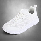 ZOFIA ATELIER white lace casual running sneakers with breathable mesh upper and rubber sole.