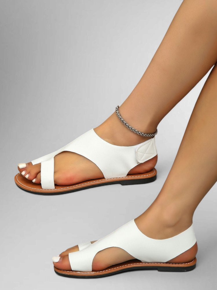 ZOFIA ATELIER white leather flat sandals with velcro toe strap and rounded toe, perfect for summer.