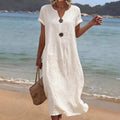 ZOFIA ATELIER white linen-blend short sleeve midi dress with decorative buttons, v-neck, and loose fit.