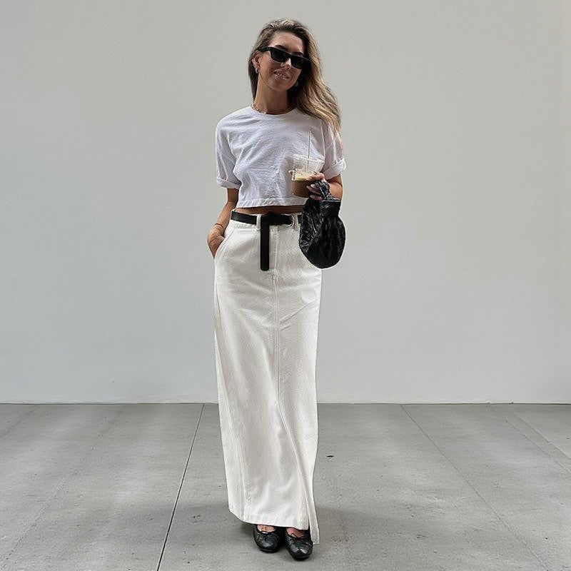 ZOFIA ATELIER white spandex A-line maxi skirt with high waist and back slit, styled casually.