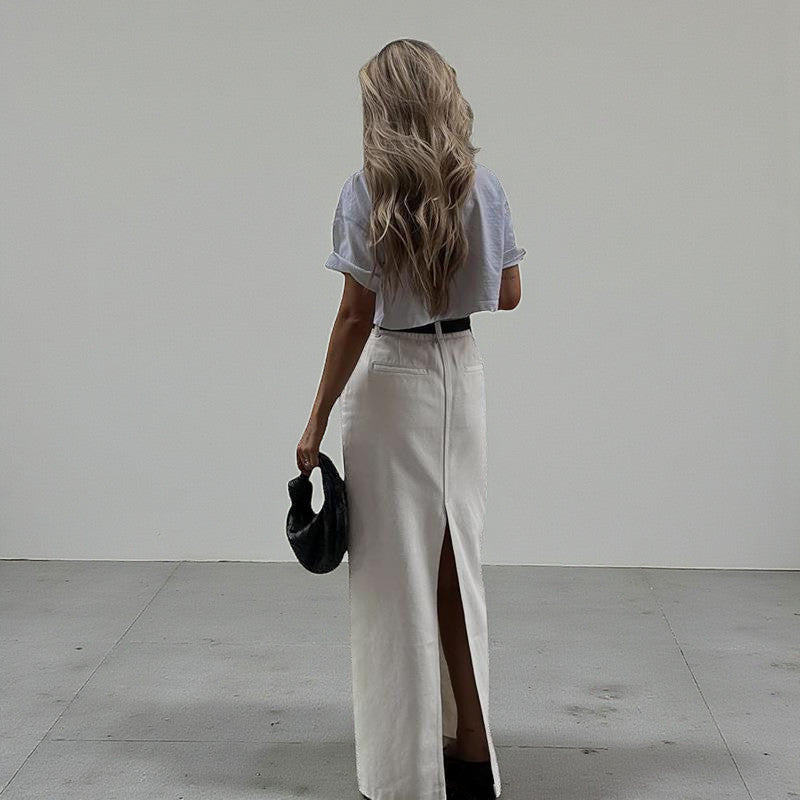 ZOFIA ATELIER white high-waist A-line maxi skirt with a back slit, made of spandex.
