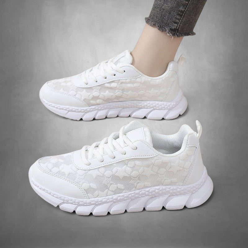 ZOFIA ATELIER white mesh casual running sneakers with lace-up closure and flat rubber sole.
