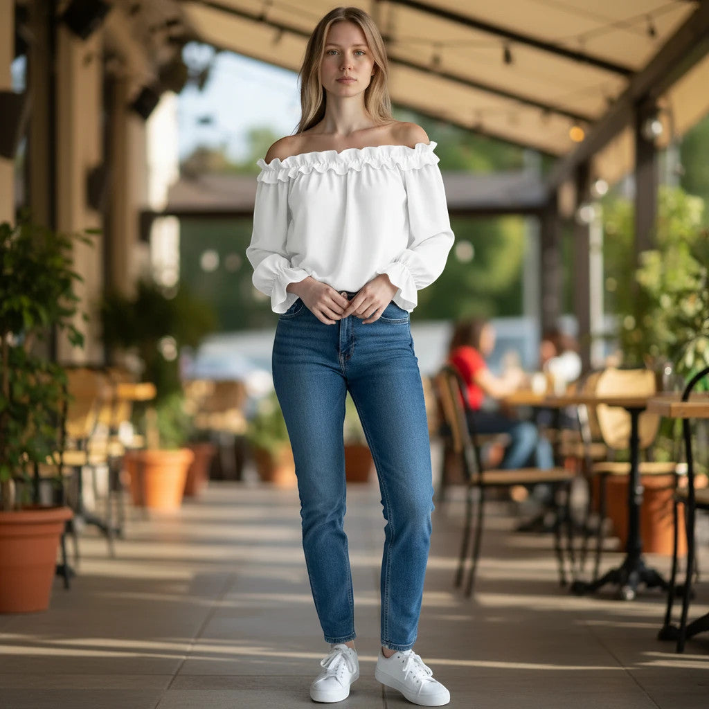 ZOFIA ATELIER white polyester off-shoulder ruffle shirt with seven-quarter sleeves, paired with blue jeans.