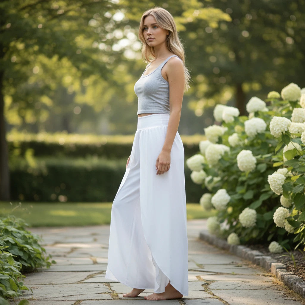ZOFIA ATELIER white polyester wide-leg cropped trousers with high elastic waist, worn by a model outdoors.