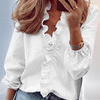 ZOFIA ATELIER white long sleeve ruffle blouse with split collar and elastic cuffs.