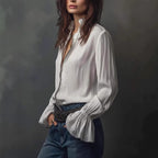 ZOFIA ATELIER white polyester long sleeve ruffled shirt with zipper detail and four-way stretch fabric.