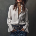 ZOFIA ATELIER white polyester long sleeve ruffled shirt with zip front and layered necklaces.