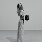 ZOFIA ATELIER white high-waist A-line spandex skirt with a back slit, worn by a model.