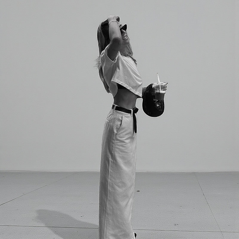 ZOFIA ATELIER white high-waist A-line spandex skirt with a back slit, worn by a model.