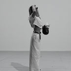 ZOFIA ATELIER white high-waist A-line spandex skirt with a back slit, worn by a model.