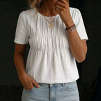 ZOFIA ATELIER white cotton-linen blend short-sleeve top with crew neck and smocked bodice detail.