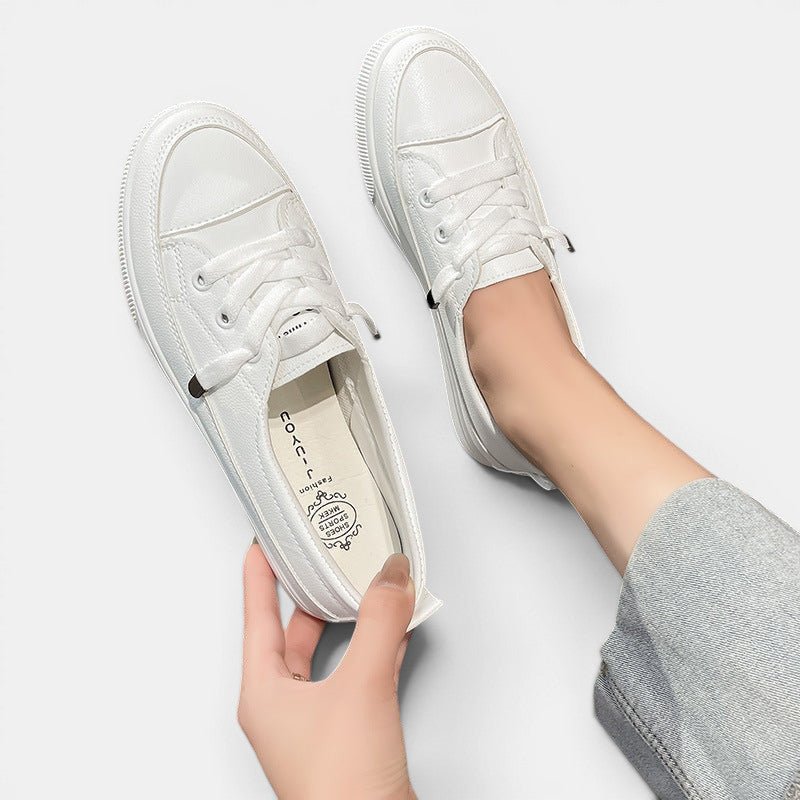 ZOFIA ATELIER white synthetic PU low-top sneakers with flat heel and front laces, perfect for casual wear.